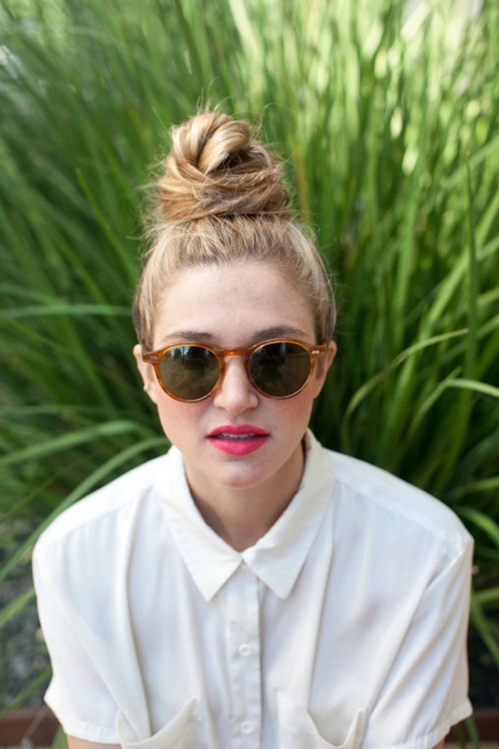 Relaxed top knot hairstyle perfect for managing humid weather in casual settings