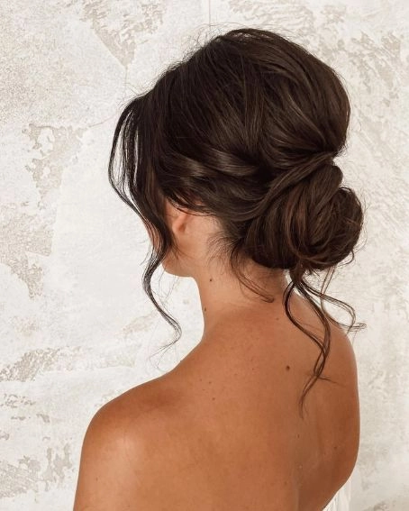 Relaxed top knot hairstyle perfect for humid weather in casual settings