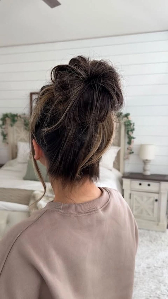 Relaxed top knot hairstyle perfect for managing humidity and casual days