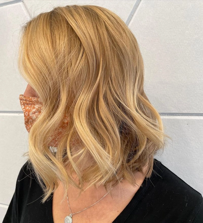 Relaxed tousled waves styled on long highlighted hair for a casual look