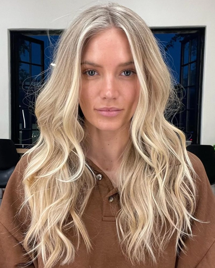 Relaxed tousled waves styled on long highlighted hair in a casual setting