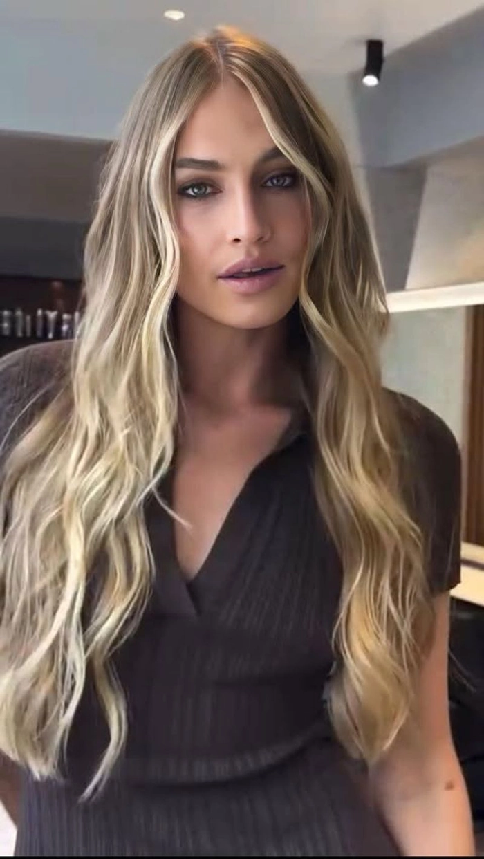 Relaxed tousled waves styled on long highlighted hair for a casual look