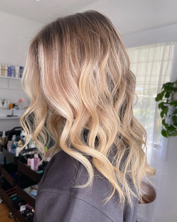 Relaxed tousled waves styled on long highlighted hair for a casual look