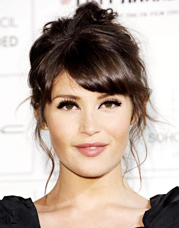 Relaxed Updo with Face Framing Pieces for Round Faces - Casual Hairstyle image of a relaxed updo with face framing pieces styled for a round face