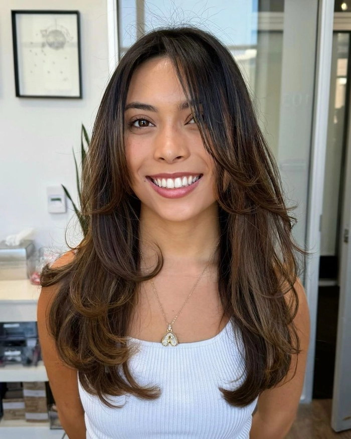 Casual Hairstyle Image 14: Voluminous Blowout for Weekend Brunch Relaxed voluminous blowout hairstyle for a long casual weekend brunch