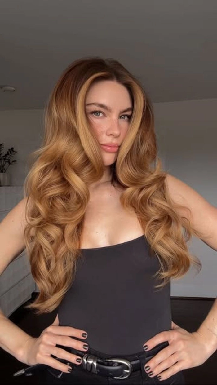 Relaxed voluminous blowout perfect for a long casual weekend brunch Model with relaxed voluminous blowout hairstyle for a casual weekend brunch