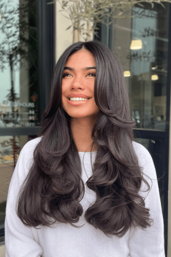 Casual Voluminous Blowout for Weekend Brunch A relaxed voluminous blowout hairstyle ideal for a long casual weekend brunch