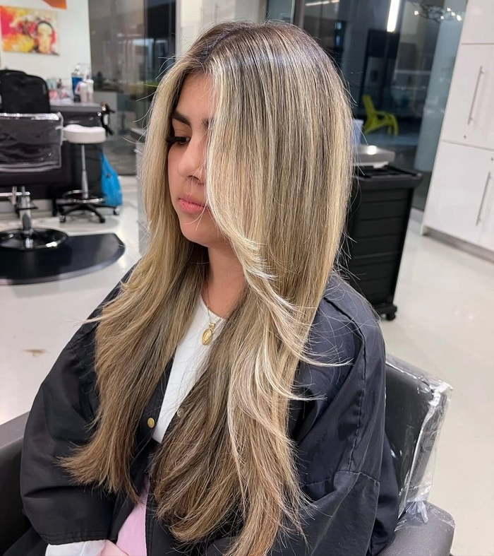 A casual voluminous blowout hairstyle ideal for a relaxed weekend brunch Relaxed voluminous blowout hairstyle for a long casual weekend brunch