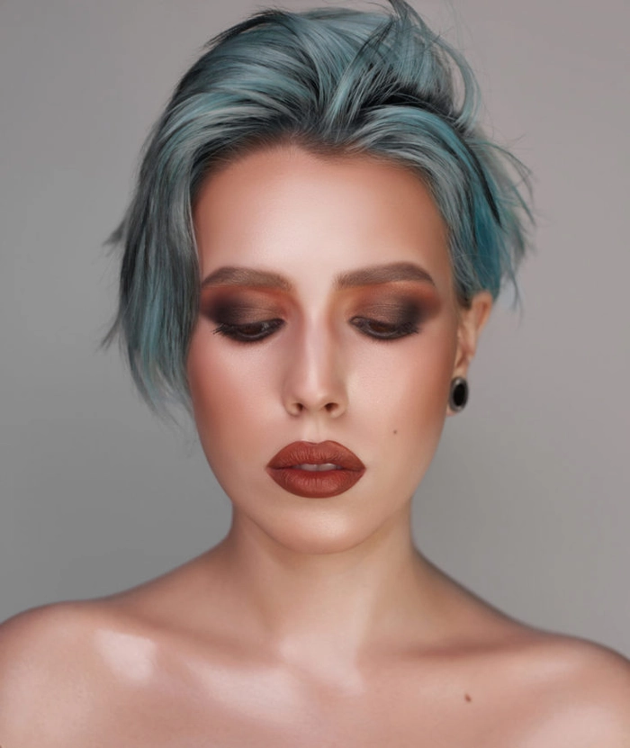Short layered hair styled into an effortless bedhead look perfect for casual days