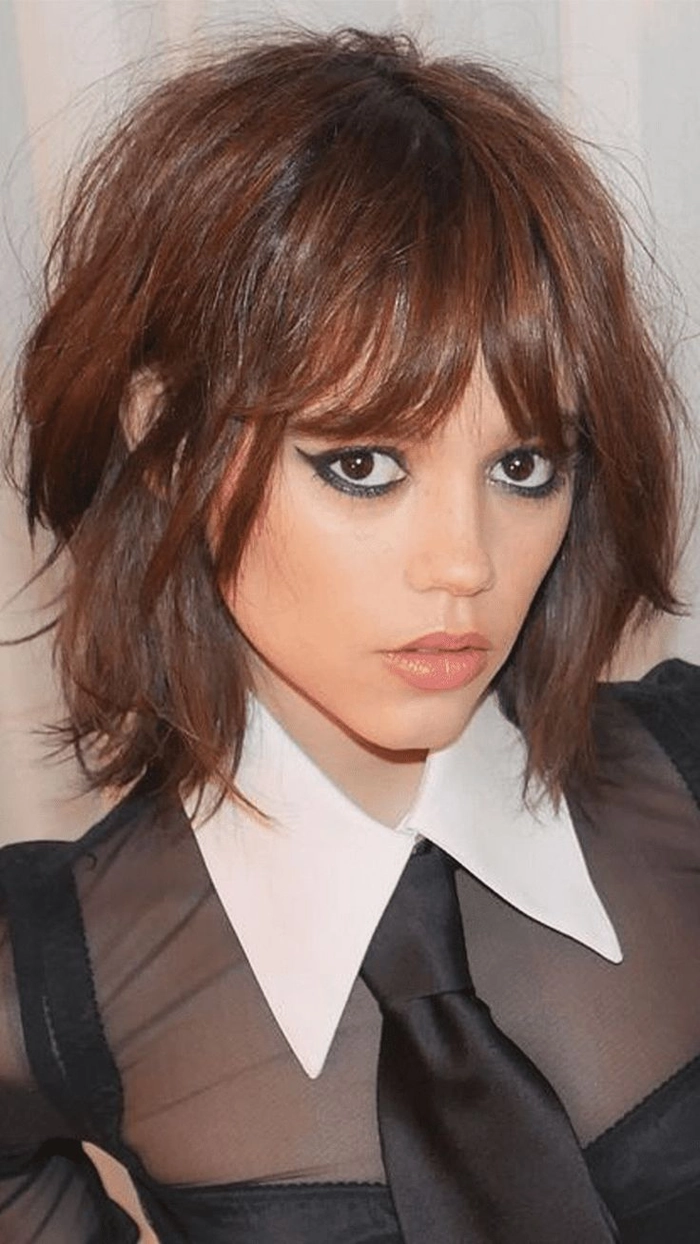 Short layered hair styled into an effortless bedhead look perfect for casual hairstyles