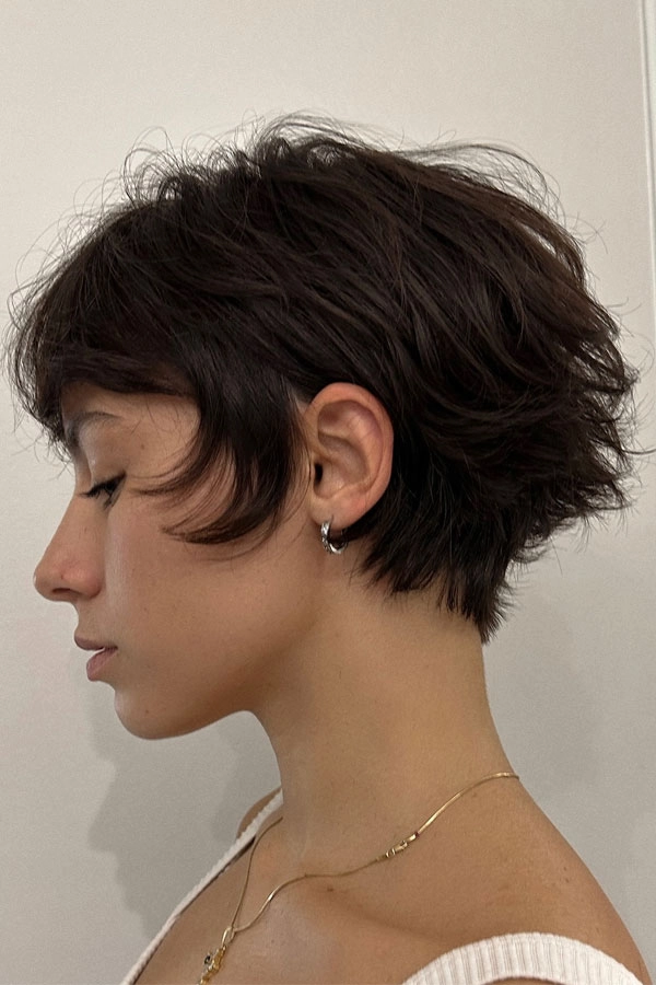 Short layered hair styled for effortless bedhead looks in a casual setting