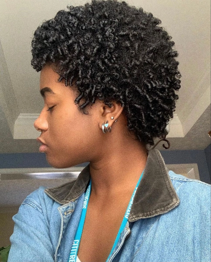 Short natural hair styled in everyday defined coils, casual look