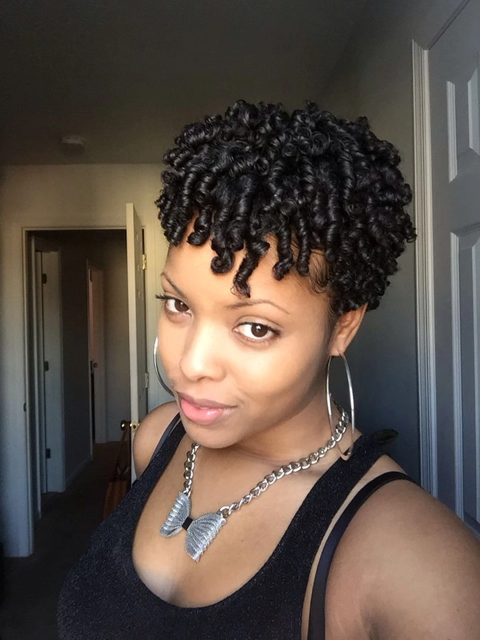 Short natural hair with defined coils styled in a casual everyday look
