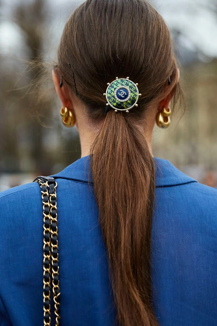 Simple barrette hairstyle with soft waves for preppy casual outfits