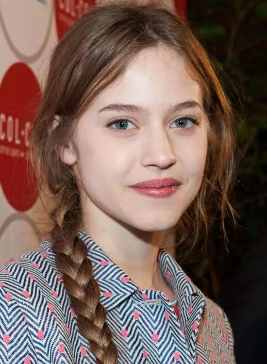 Simple braided hairstyle worn by a college student with casual outfit