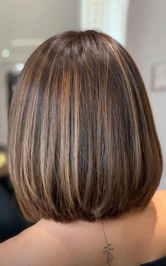 Casual hairstyle idea featuring a simple bob for quick morning styling Woman with a sleek low maintenance bob hairstyle perfect for busy mornings