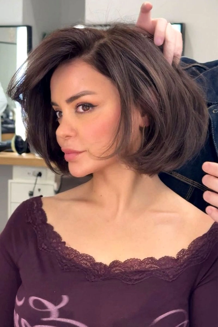 Simple tucked behind ears styling for a blunt bob haircut