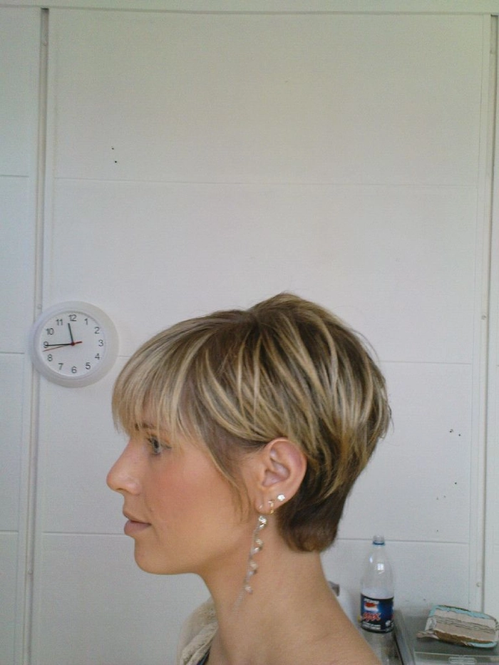 Simple tucked behind ears styling for a blunt bob hairstyle