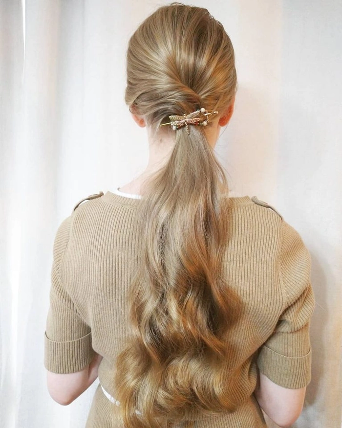 Woman showing a simple twisted updo hairstyle perfect for casual Friday office wear