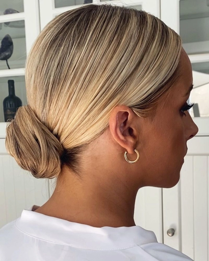 Woman over 40 with a relaxed low bun hairstyle perfect for casual looks