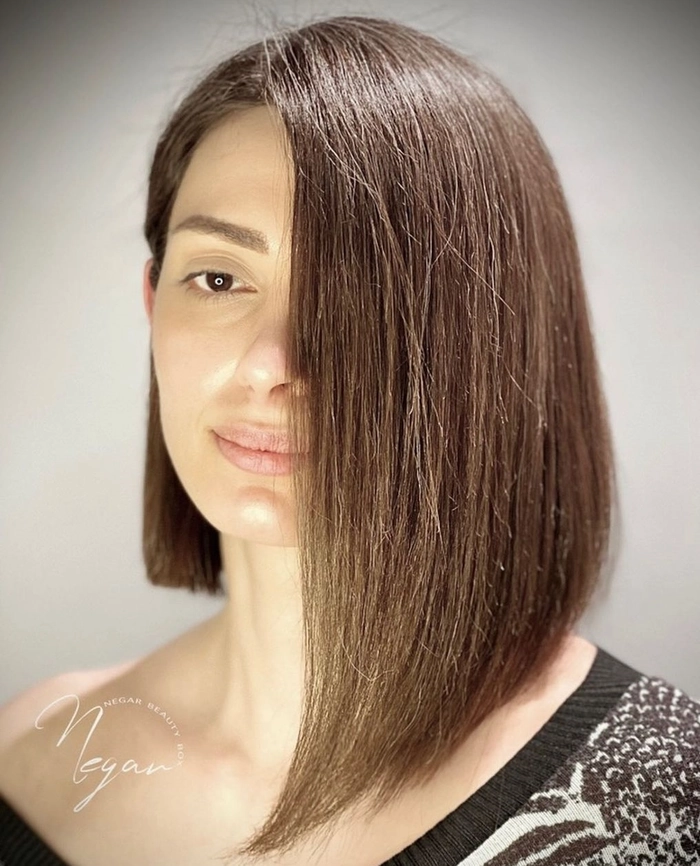 Woman with relaxed side swept hairstyle on asymmetrical bob showcasing casual elegance