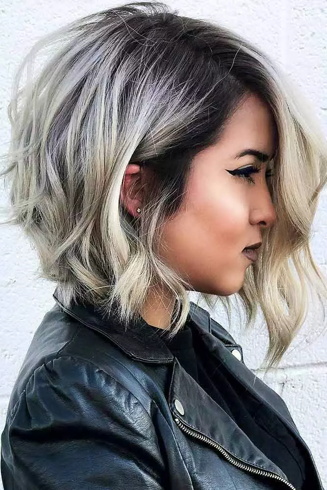 Woman with relaxed side swept hairstyle on asymmetrical bob in casual setting