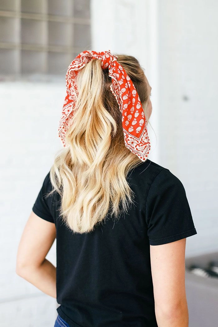 Effortless retro casual ponytail with a colorful bandana accessory Woman showcasing a quick bandana ponytail style perfect for retro casual vibes