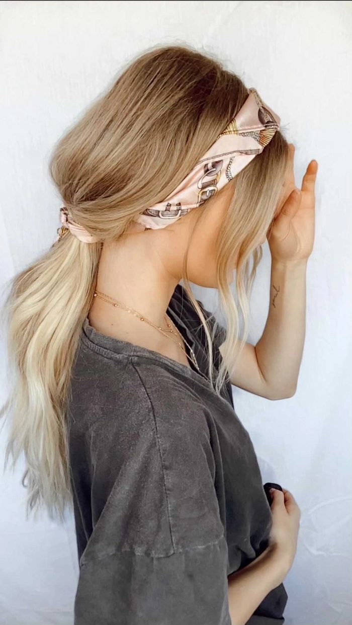 Casual hairstyle idea with bandana ponytail for retro vibes Woman sporting a quick bandana ponytail style for a retro casual look