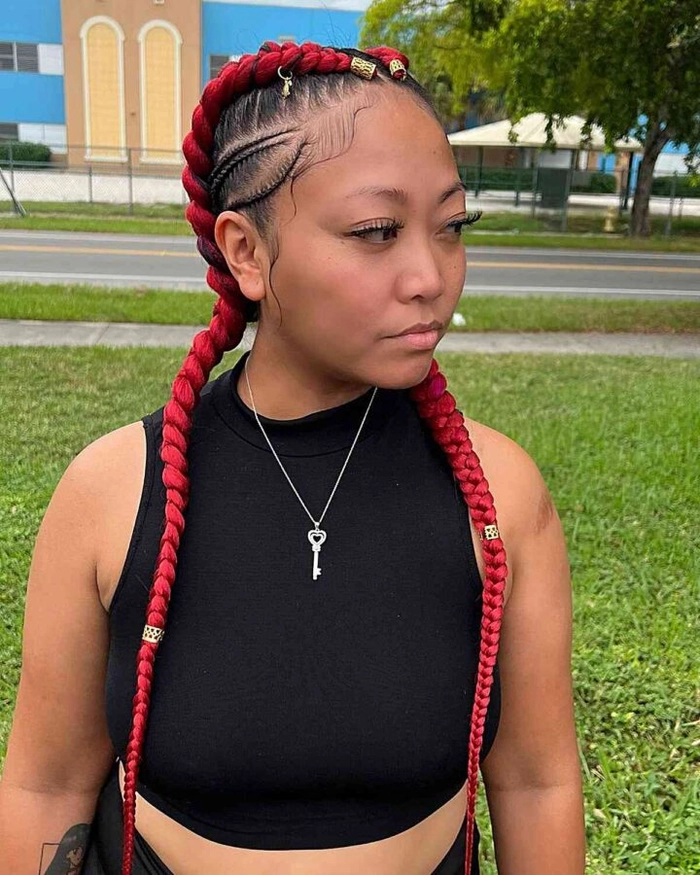 Woman with quick braided pigtails working in garden during casual outdoor chores