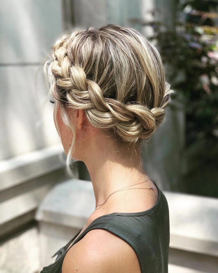 Woman with a casual halo braid enjoying a sunny summer vacation