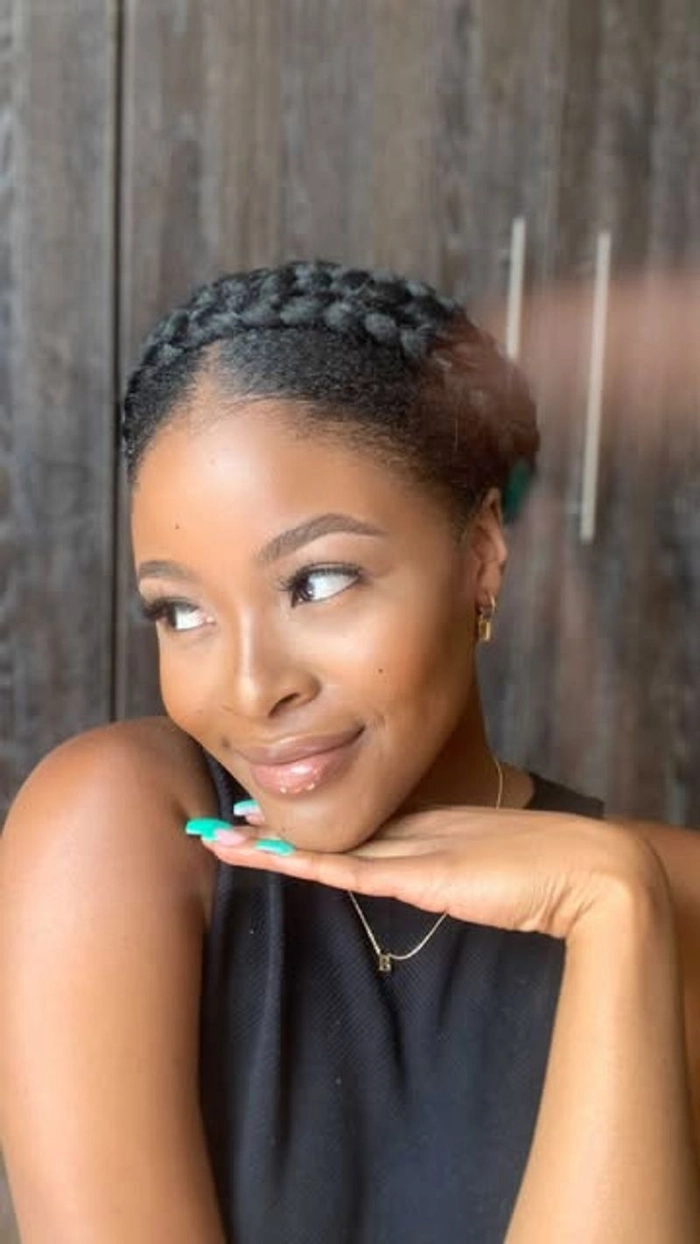 Woman with a casual halo braid styled for a summer vacation look