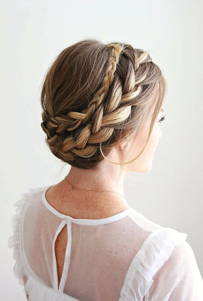 Woman with a casual halo braid hairstyle perfect for summer vacations