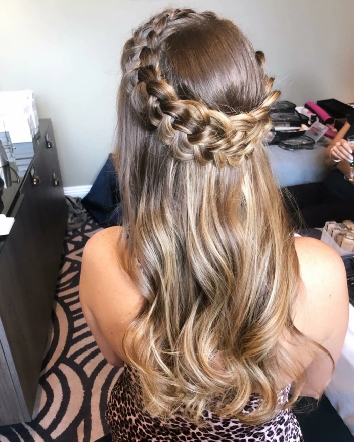 Woman with a casual milkmaid braid enjoying an outdoor picnic