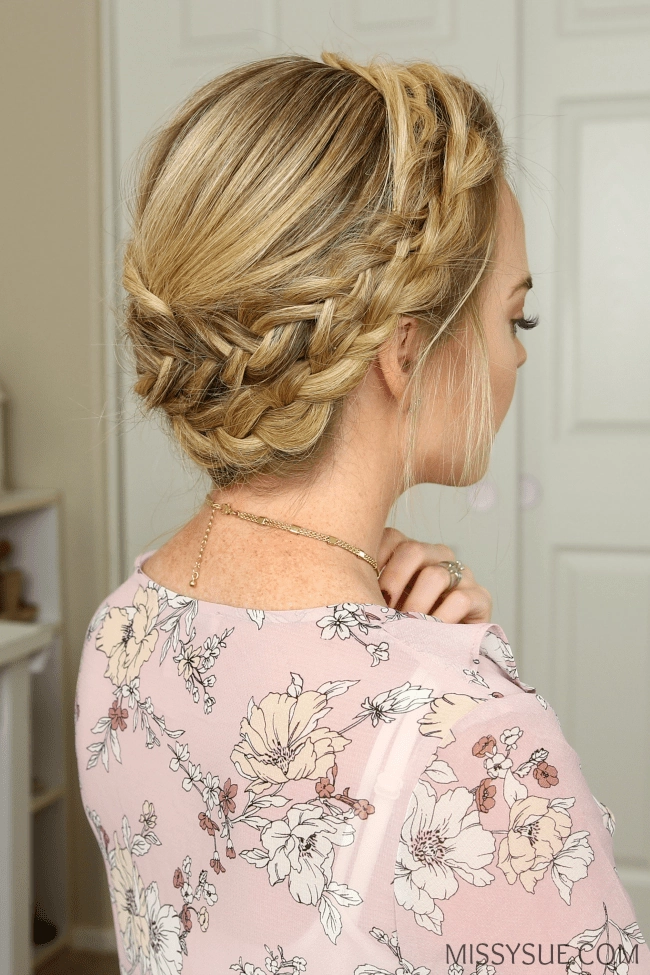 Woman with a casual milkmaid braid enjoying an outdoor picnic