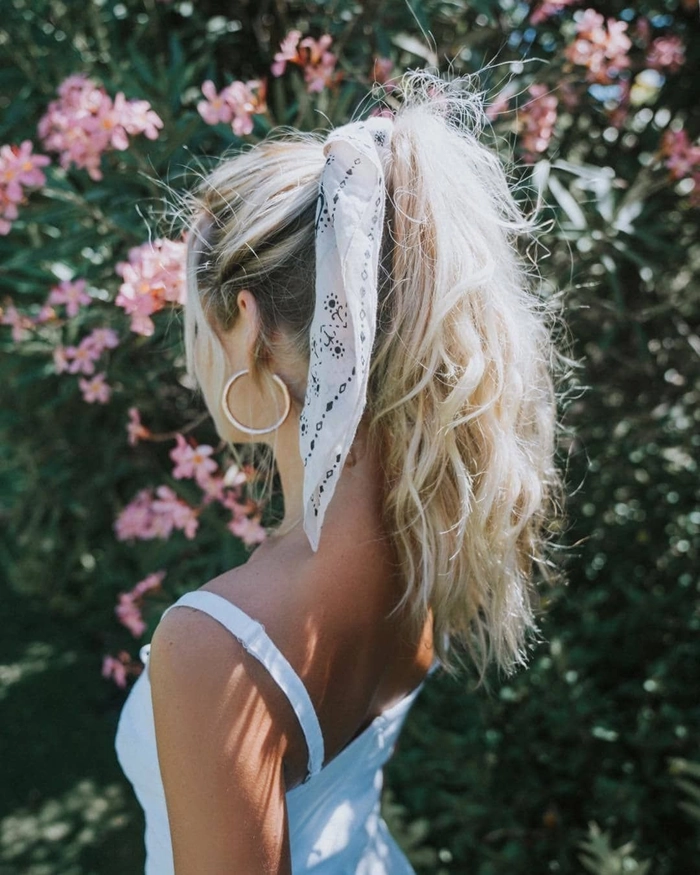 Effortless simple bandana hairstyle perfect for casual bad hair day looks Woman wearing a colorful bandana styled in an easy casual hairstyle for bad hair days