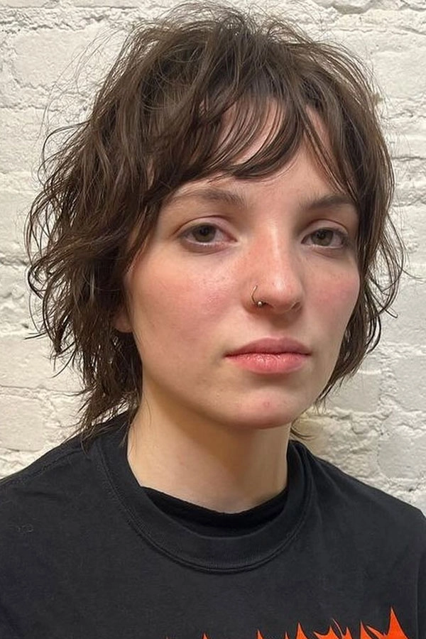 Effortless shag haircut styling perfect for laid-back casual weekends Woman with an effortless shag haircut styled casually for a weekend look