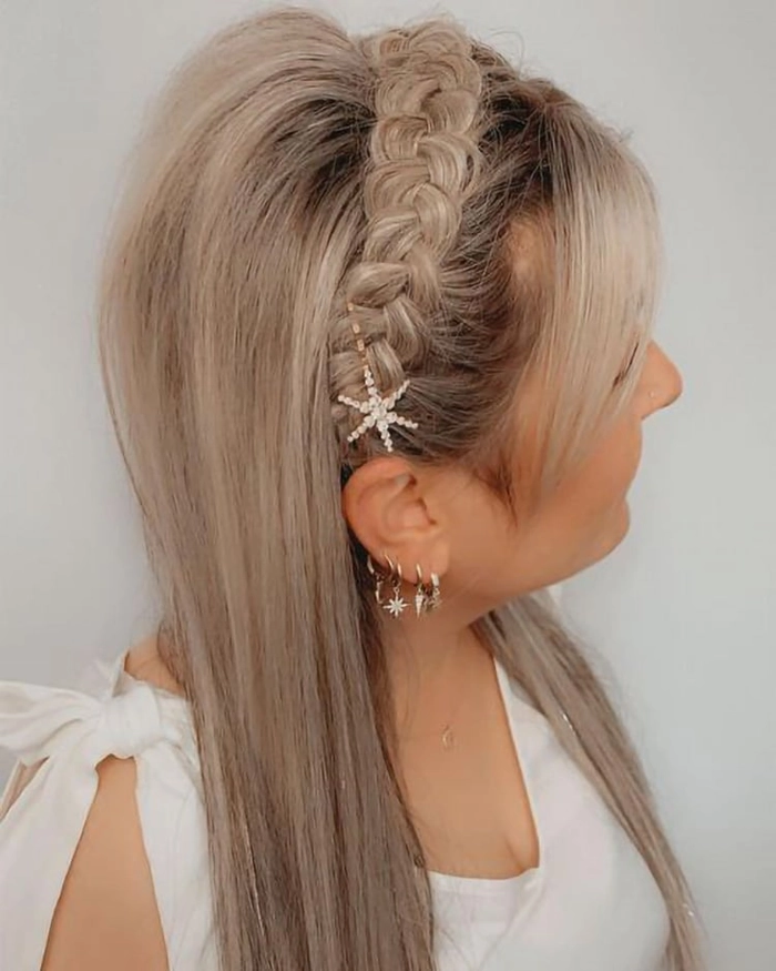 Woman with long straight hair wearing a casual braided headband hairstyle