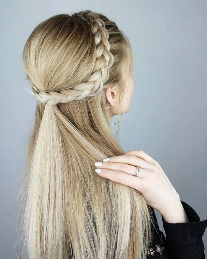 Woman with long straight hair wearing a casual braided headband hairstyle