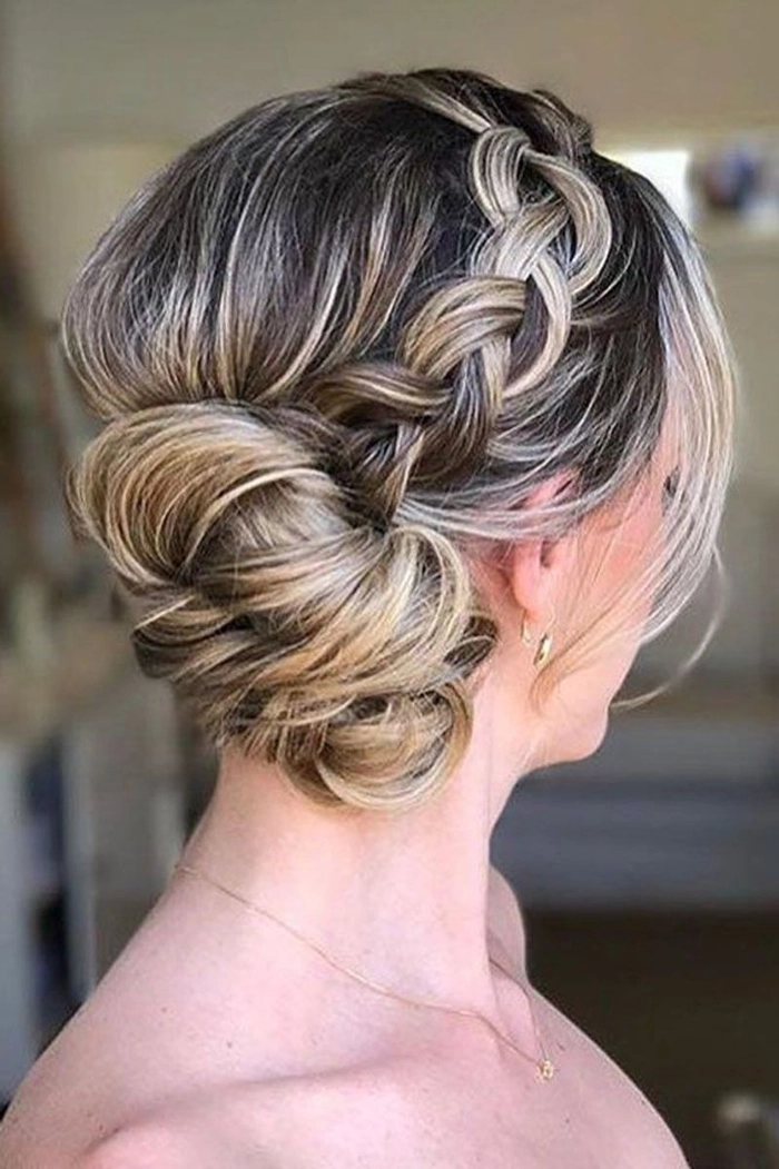 Woman over 40 with a relaxed low bun hairstyle in a casual setting