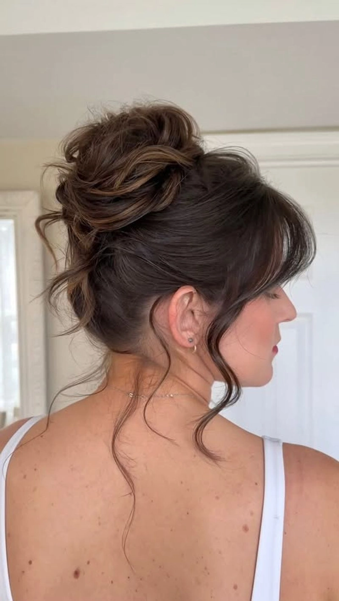 Woman over 40 with a casual relaxed low bun hairstyle