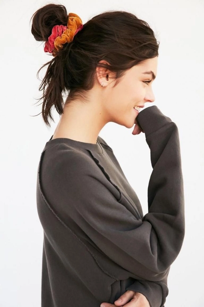 Woman with quick scrunchie hairstyles for 90s casual aesthetics showing a playful and effortless look