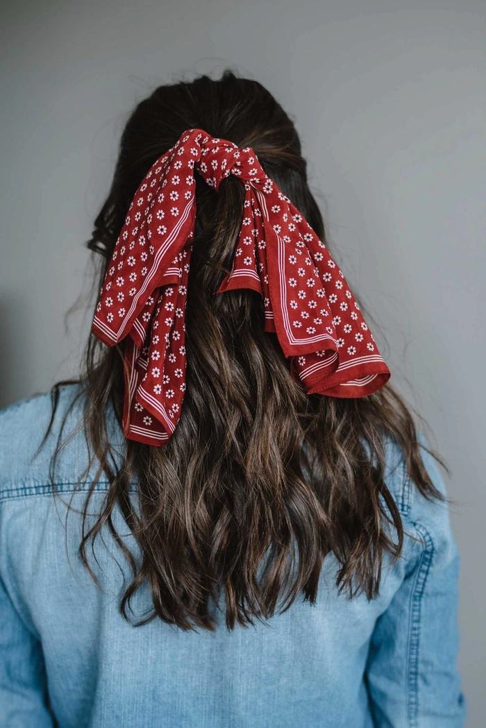 Casual hairstyle featuring an easy bandana look for quick styling on bad hair days Woman wearing a red bandana styled in a simple bandana hairstyle for a bad hair day