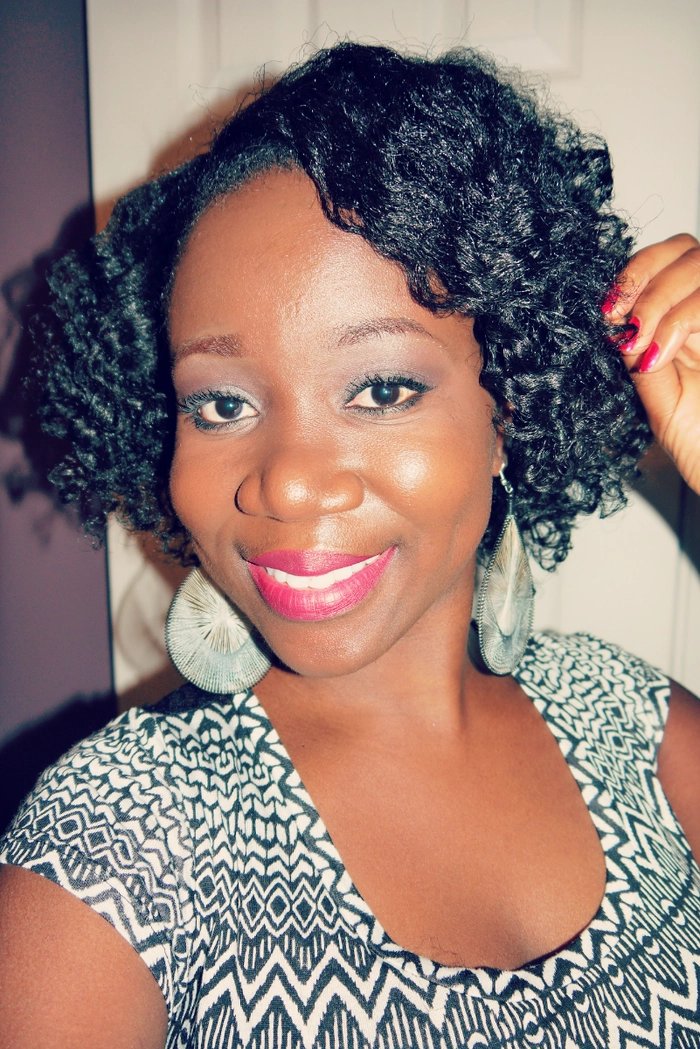 Casual relaxed braid out hairstyle perfect for natural coil textures Woman with relaxed braid out hairstyle showcasing natural coils