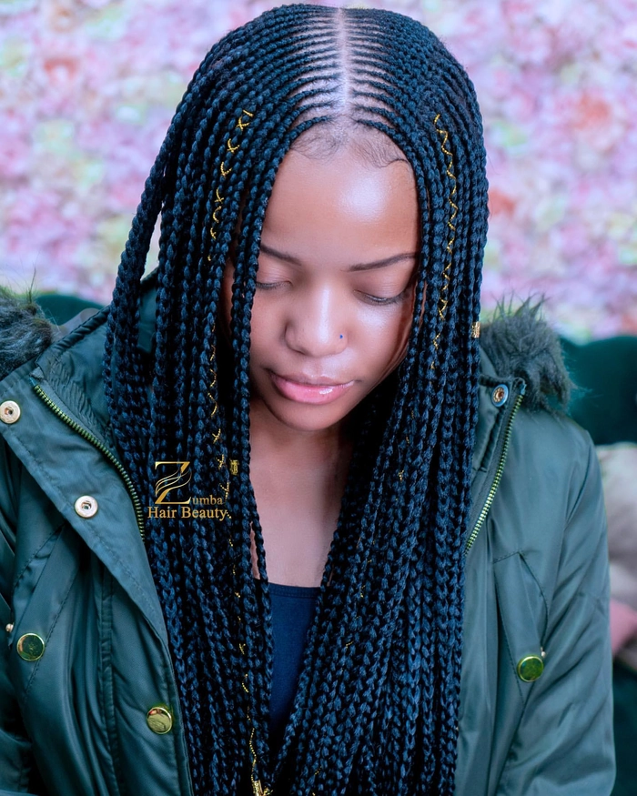Casual relaxed braid out hairstyle for natural coils on medium-length hair Woman with relaxed braid out hairstyle showcasing natural coils in a casual setting