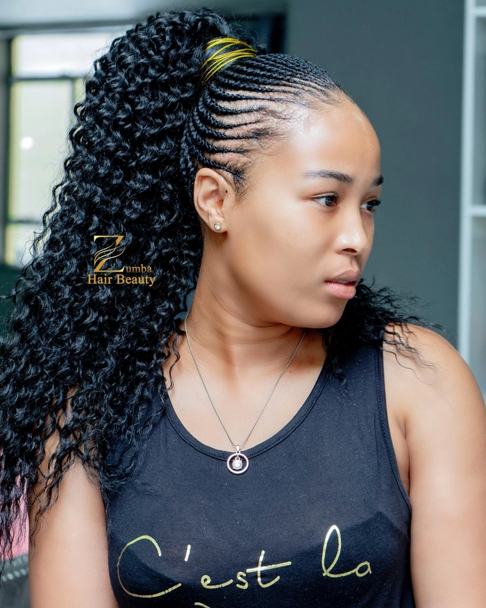 Casual relaxed braid out hairstyle perfect for natural coils look number 10 Woman showcasing relaxed braid out hairstyle on natural coil hair