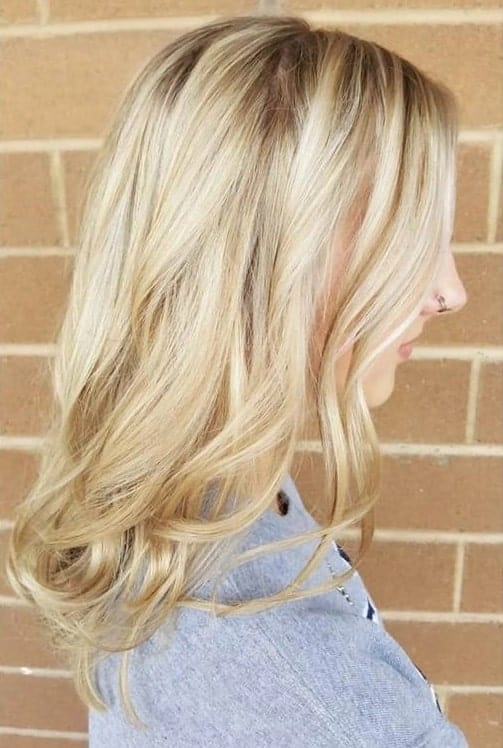 Casual hairstyle featuring relaxed loose curls on medium length hair, image 12 Woman with relaxed loose curls for medium length hair in a casual style