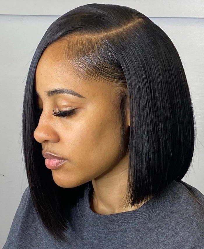 Woman with relaxed side swept hairstyle on an asymmetrical bob in casual setting