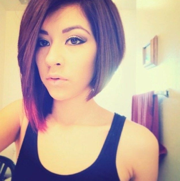 Woman with relaxed side swept hairstyle on asymmetrical bob in casual setting