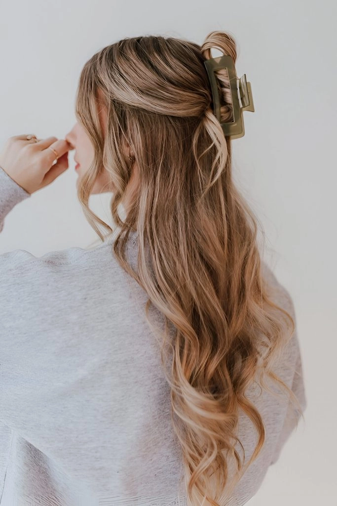 Effortless simple claw clip twist for shoulder-length hair in everyday casual look woman with shoulder-length hair styled in a simple claw clip twist casual hairstyle