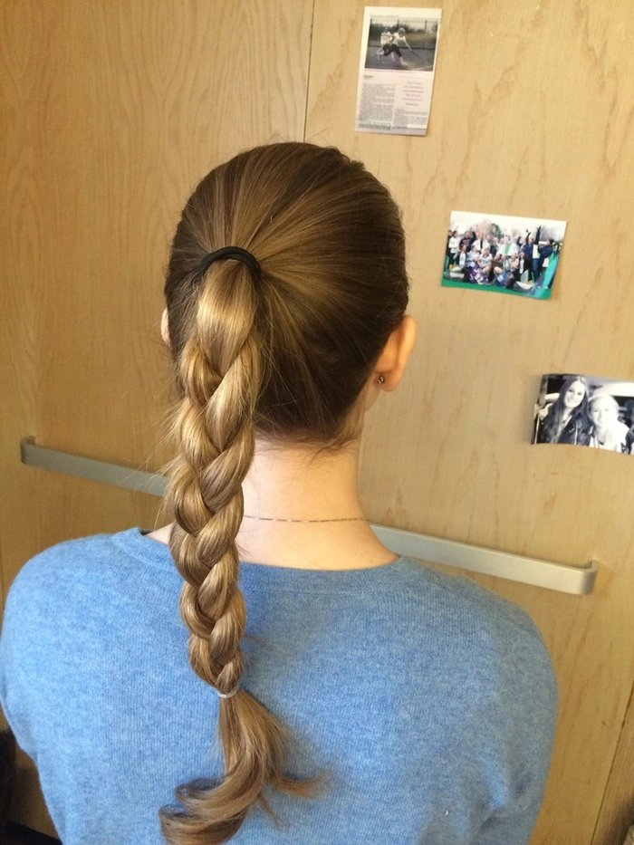 Woman with a simple rope braid ponytail styled for sporty casual days